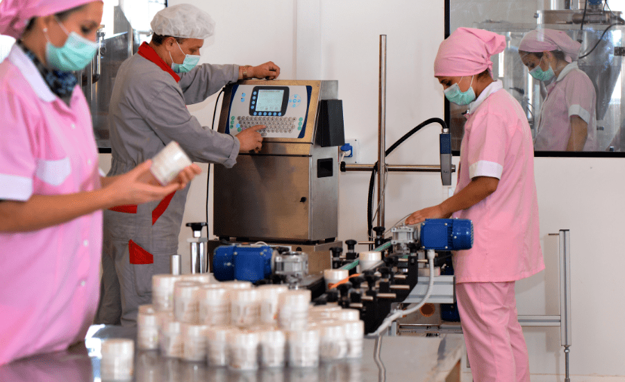 People working at a skincare factory 