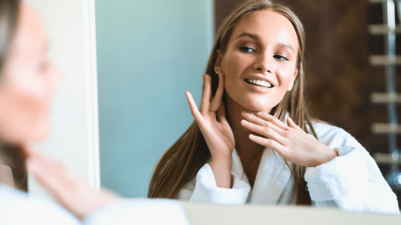 wom smiling touching skin