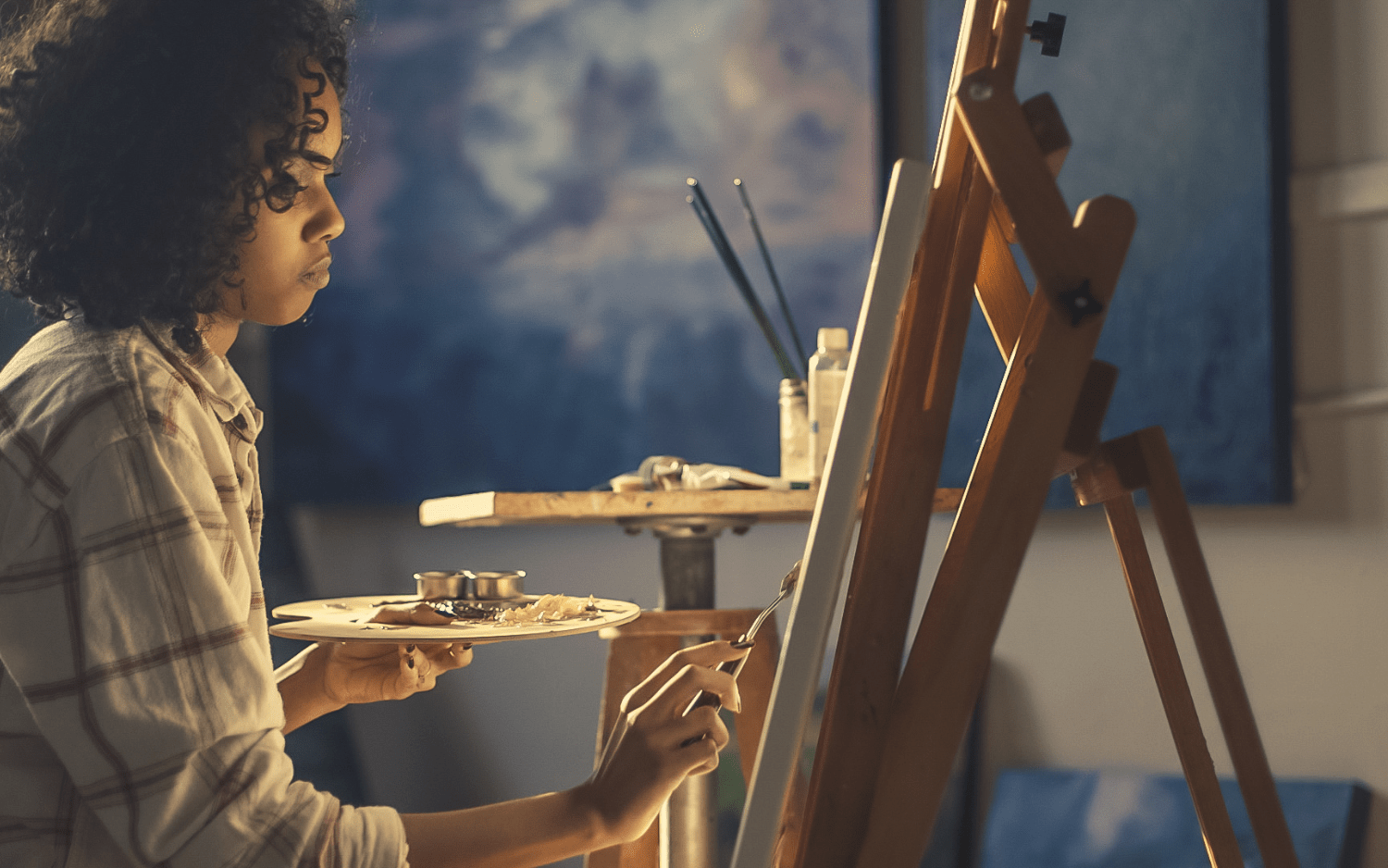 women painting calmly 