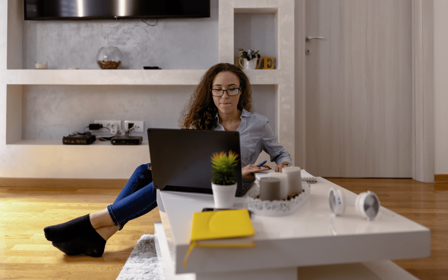 women relaxing while working on laptop 