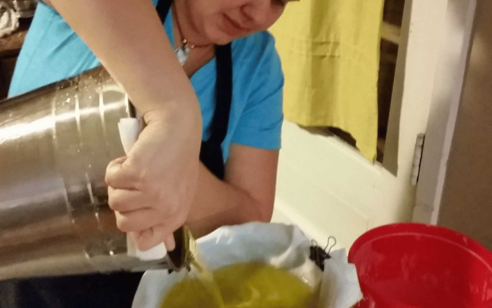 Brittany pouring tallow into pots