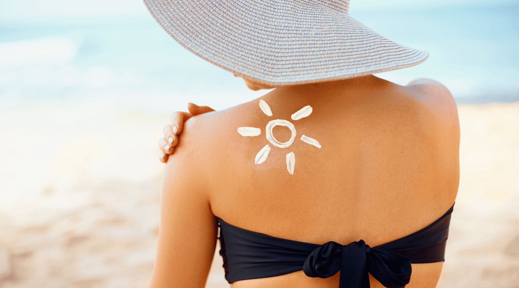 sunscreen on back at beach