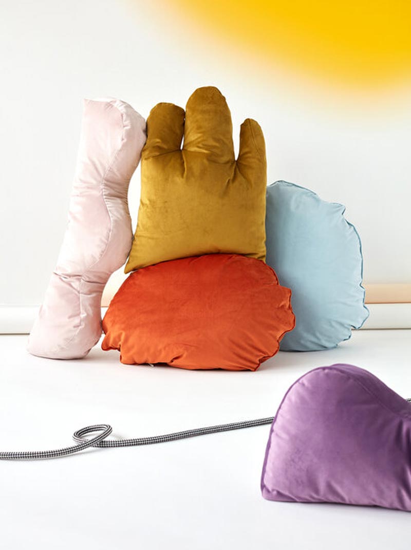 a pile of squishy, cushions in odd round shapes and fun colors
