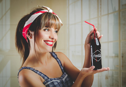 Woman holding a refreshing cola