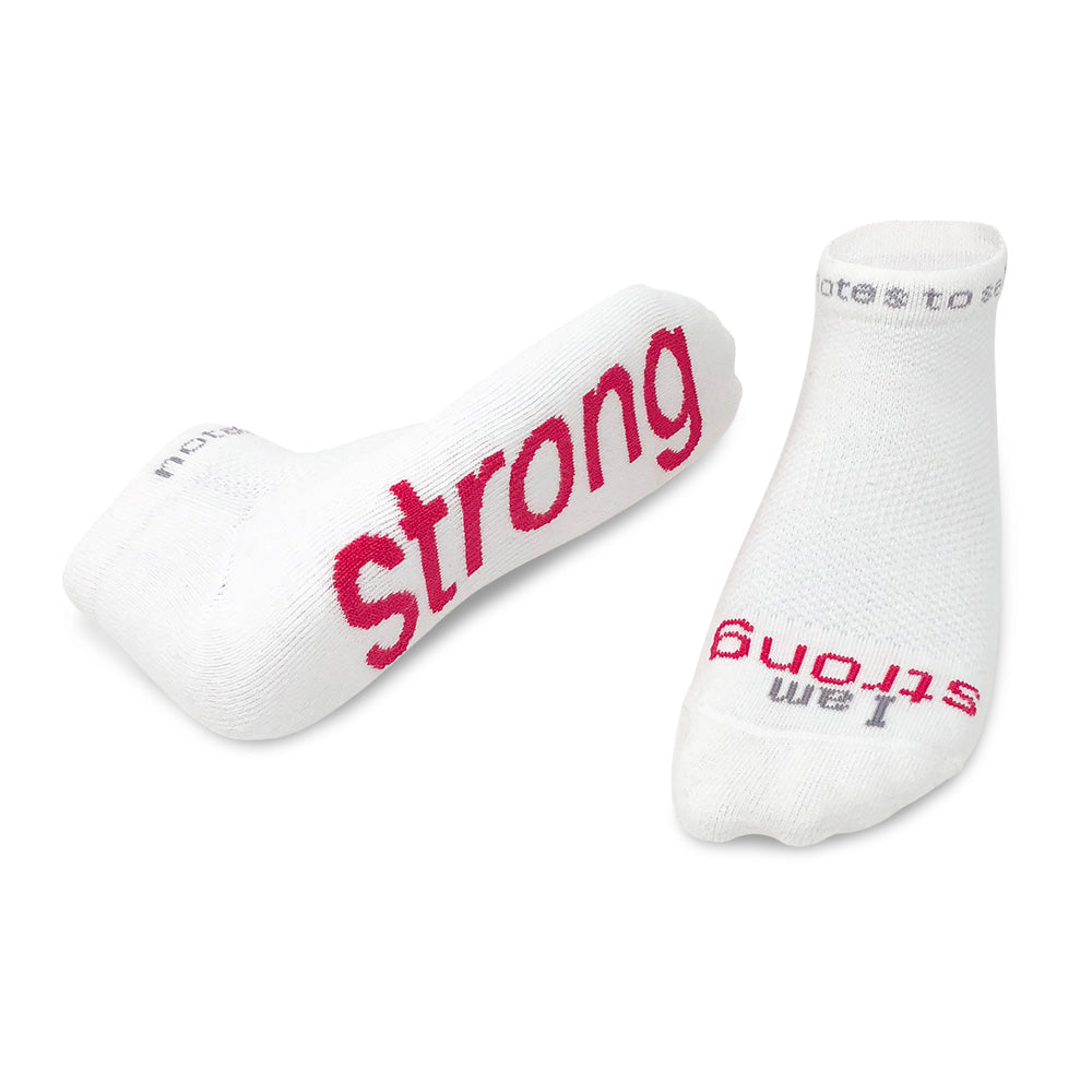 I am strong™ white low-cut socks with bold pink words