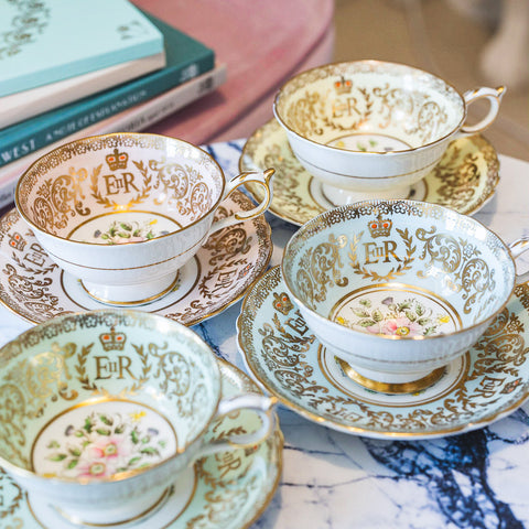 Paragon teacups in blue, pink, yellow and green produced to mark the coronation of Queen Elizabeth II in 1953.