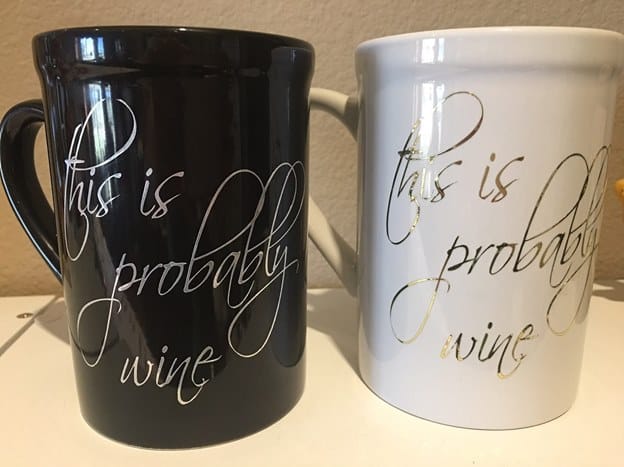 Black and white coffee mugs with metallic ink printed on front