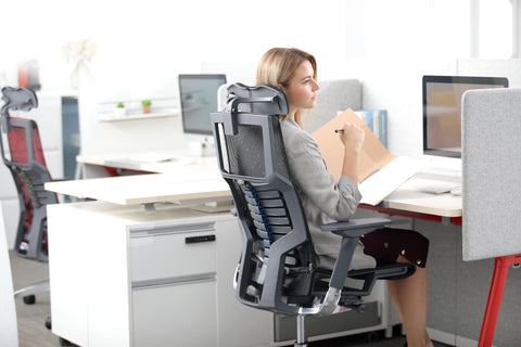 A woman sitting on Pofit chair