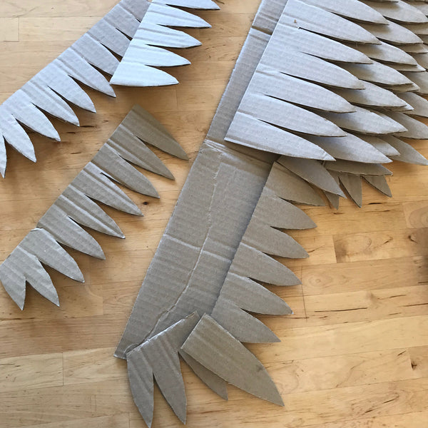 cardboard feather shapes to make wings