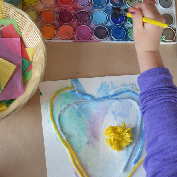 child painting a heart