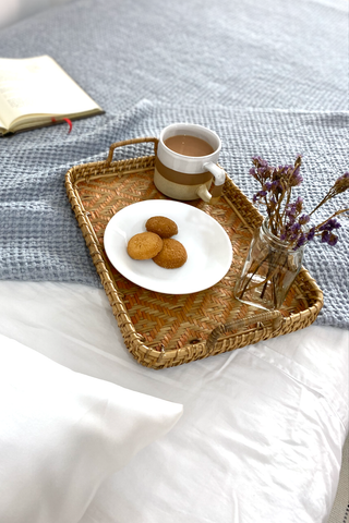 A cup of chai next to our Peace Silk Pillowcase 