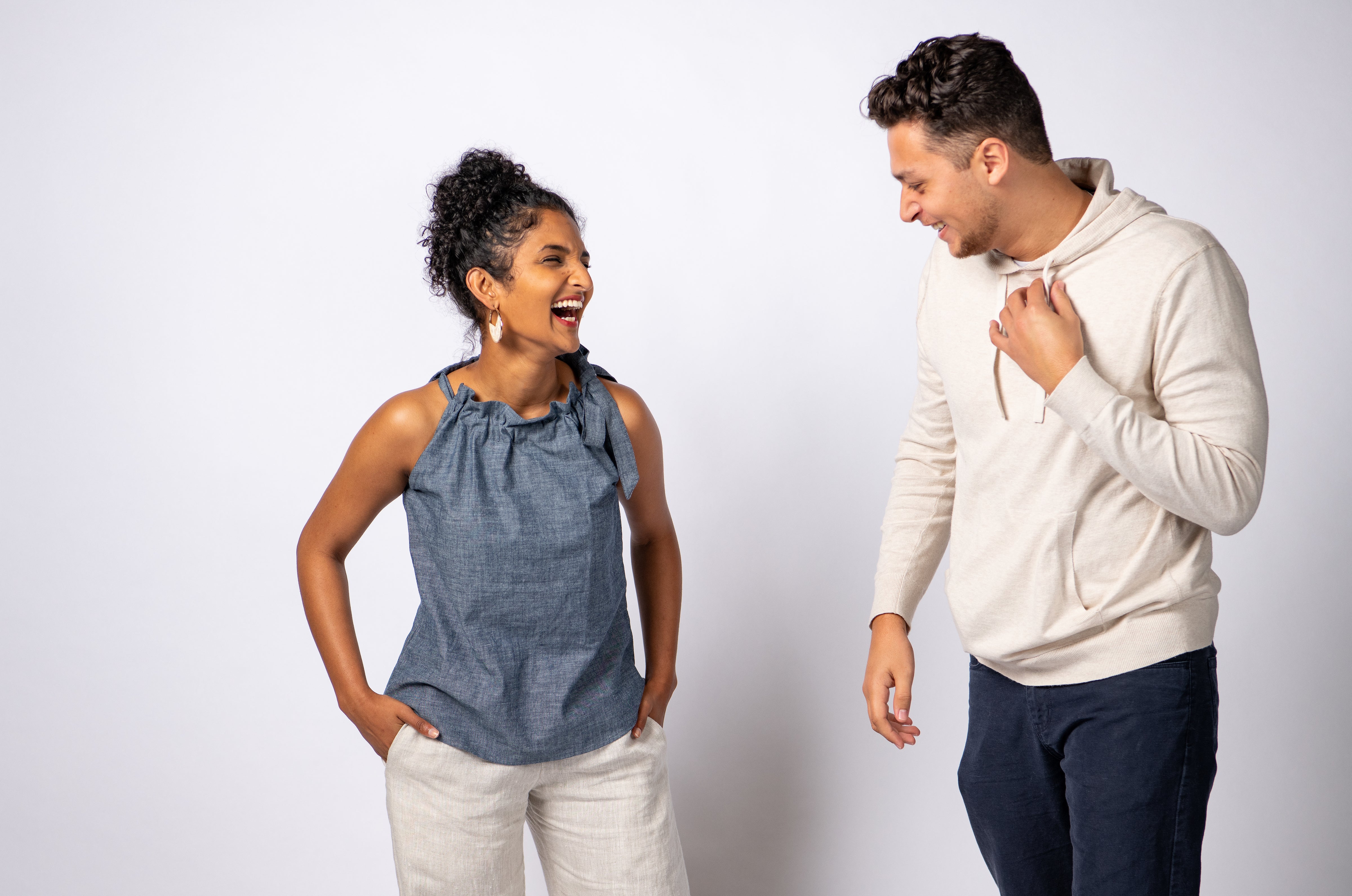 Woman wearing Swahlee Tie-Neck Halter Top in Chambray.