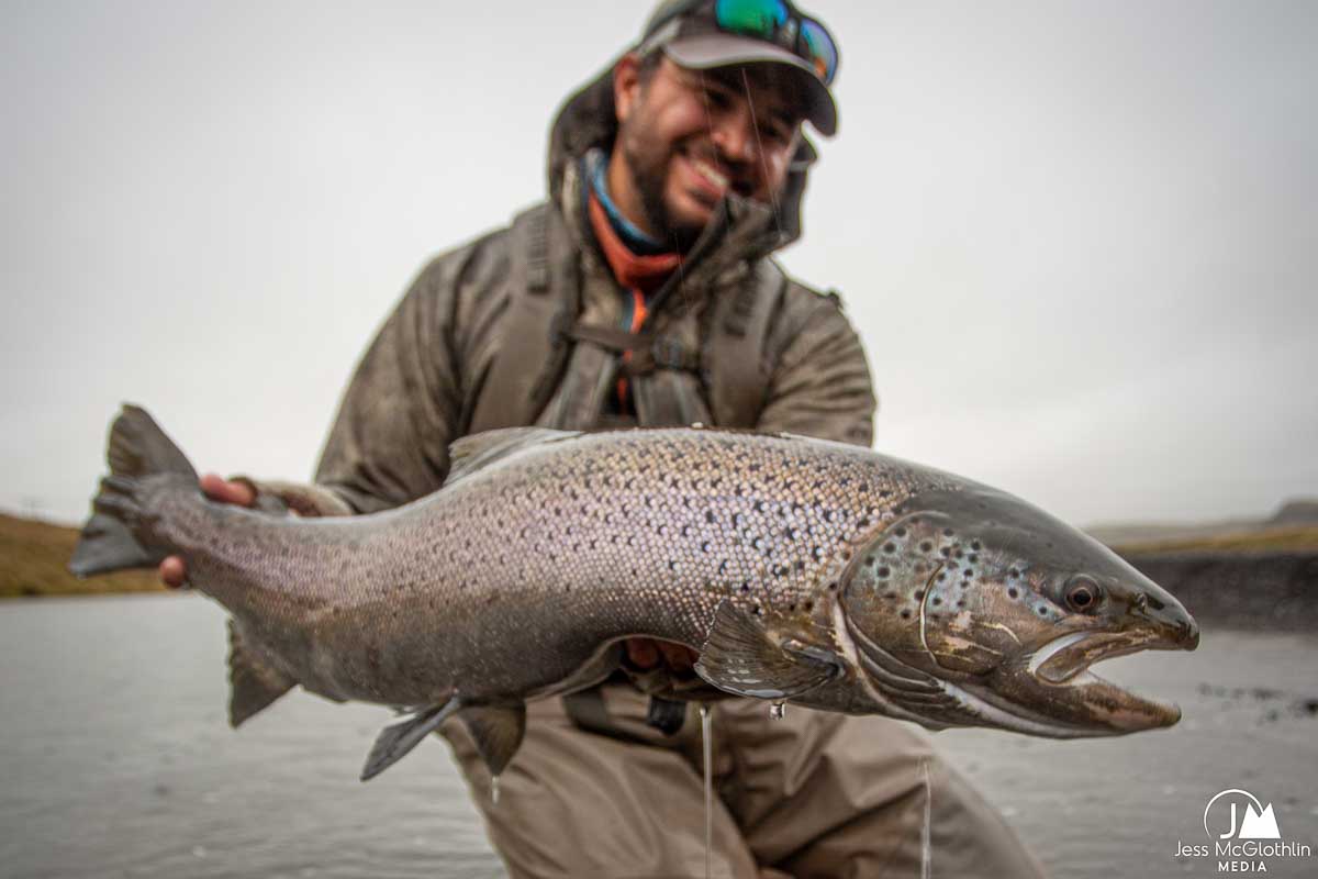 Photo of trophy brown trout and fly fisherman