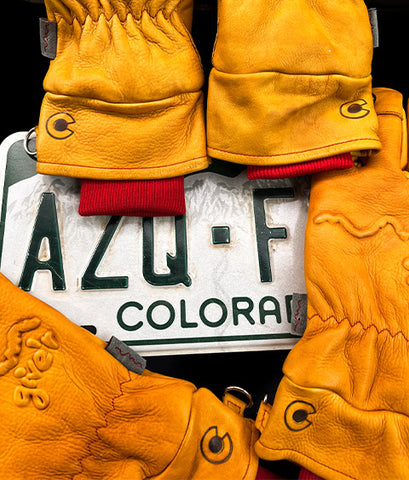 Colorado branded gloves with Colorado license plate