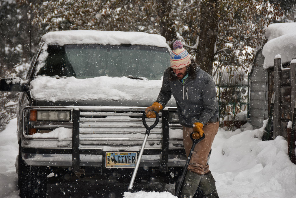 Bubba shoveling snow in Classic Give'r Mittens