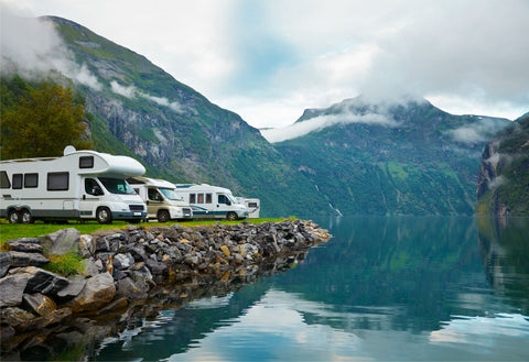 Motorhome by lake and mountains fitted with motorhome tracking