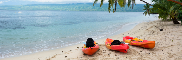 Luksea wearable kayaks on beach in fiji