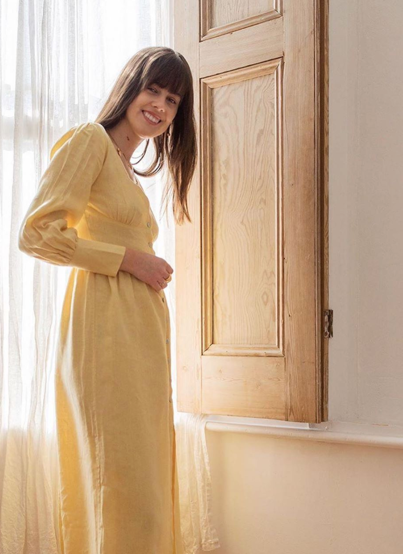 Nadine Banks, ethical fashion and style blogger, wearing a sunshine yellow dress