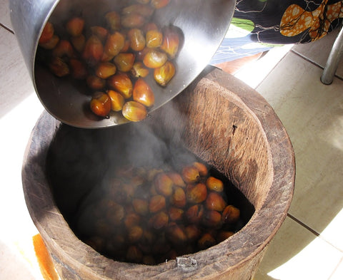 boiled palm fruits in a mortar 