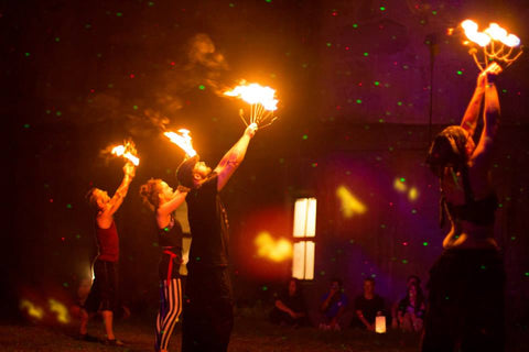 Fire dancers at city of night