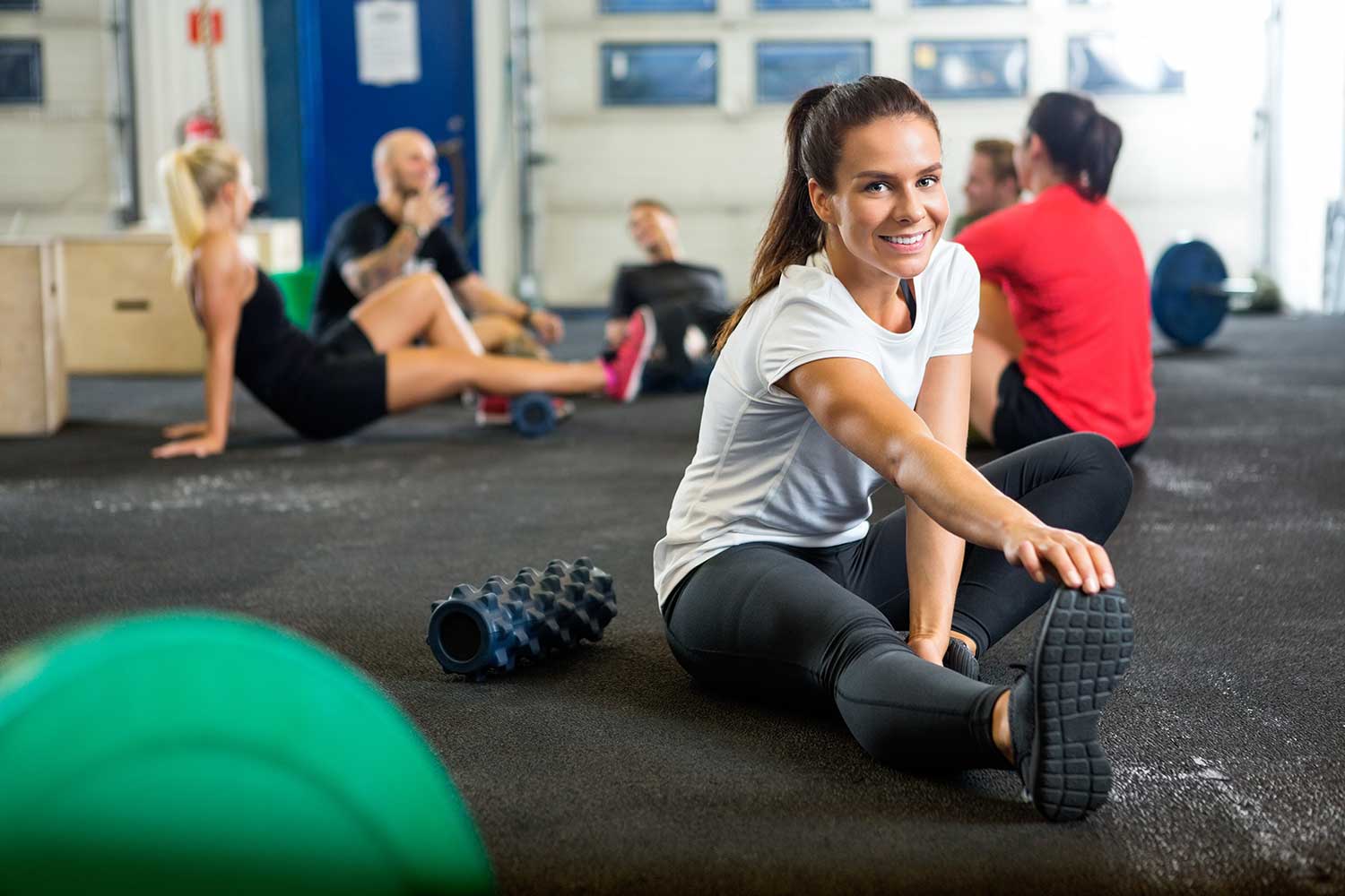 Lady stretching after an intense interval training workout