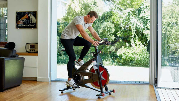 Man Losing Weight on Spin Bike At Home