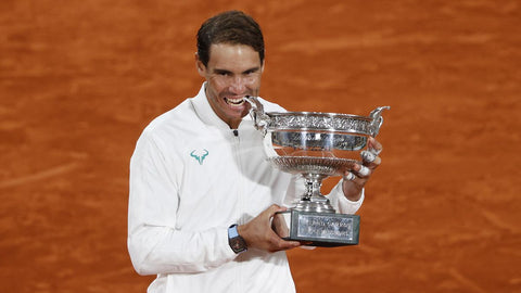 Nadal-holding-the-The-Musketeers-cup-after-winning-the-french-open-for-the-fourteenth-time