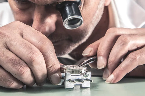 Watchmaker-using-a-loupe-Zurichberg