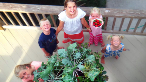 children around a Garden Tower®