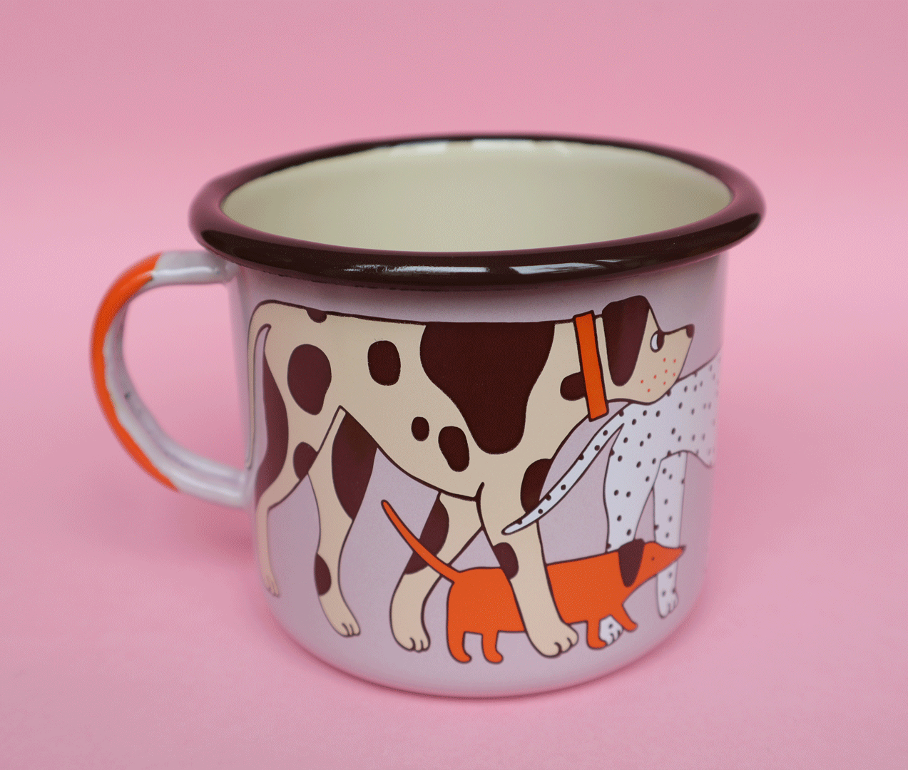 pink enamel mug with dogs spinning