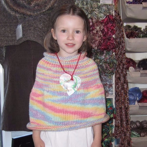 photo of girl in capelet