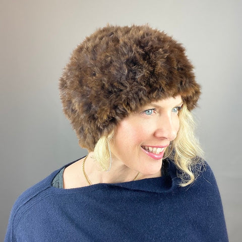 photo of woman wearing rabbit fur hat