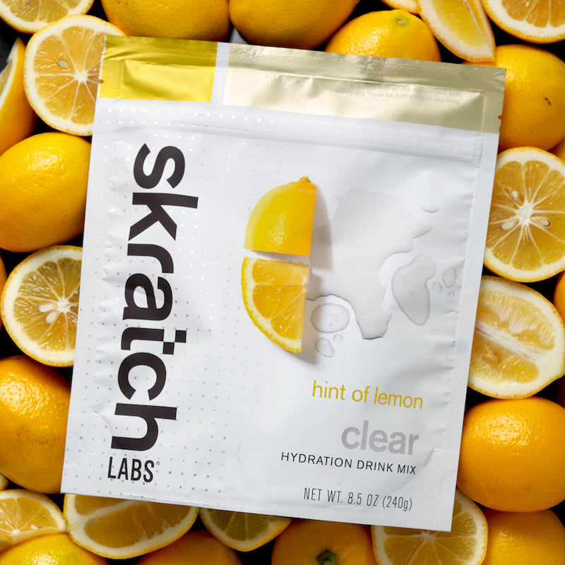 Skratch Labs Clear Hydration Drink Mix Lemon Fruit Background