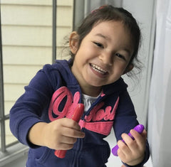 girl smiling with hair chalk in hair