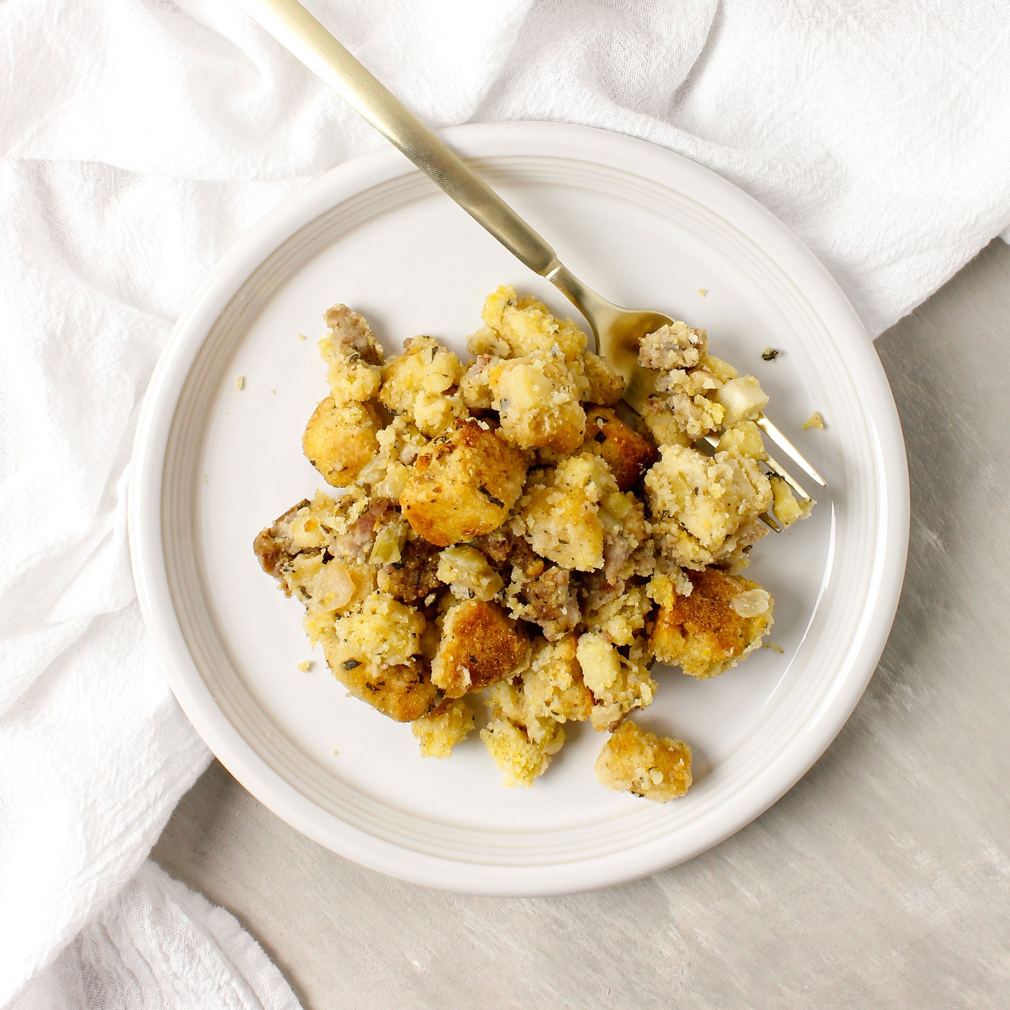 gluten free sausage and cornbread stuffing on white plate