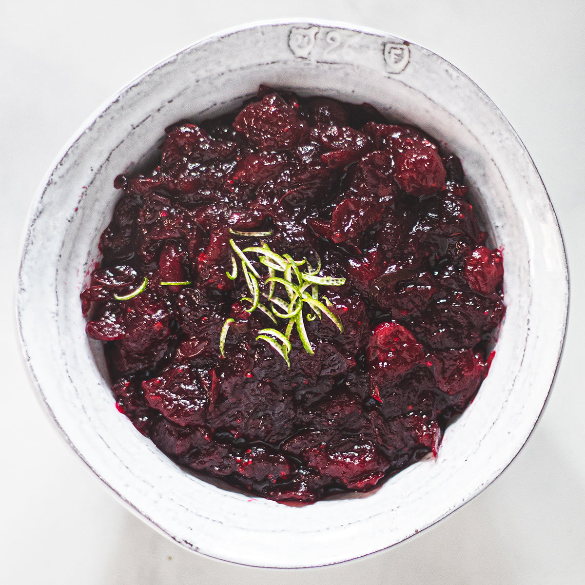 holiday cranberry sauce with lime and chili in white bowl