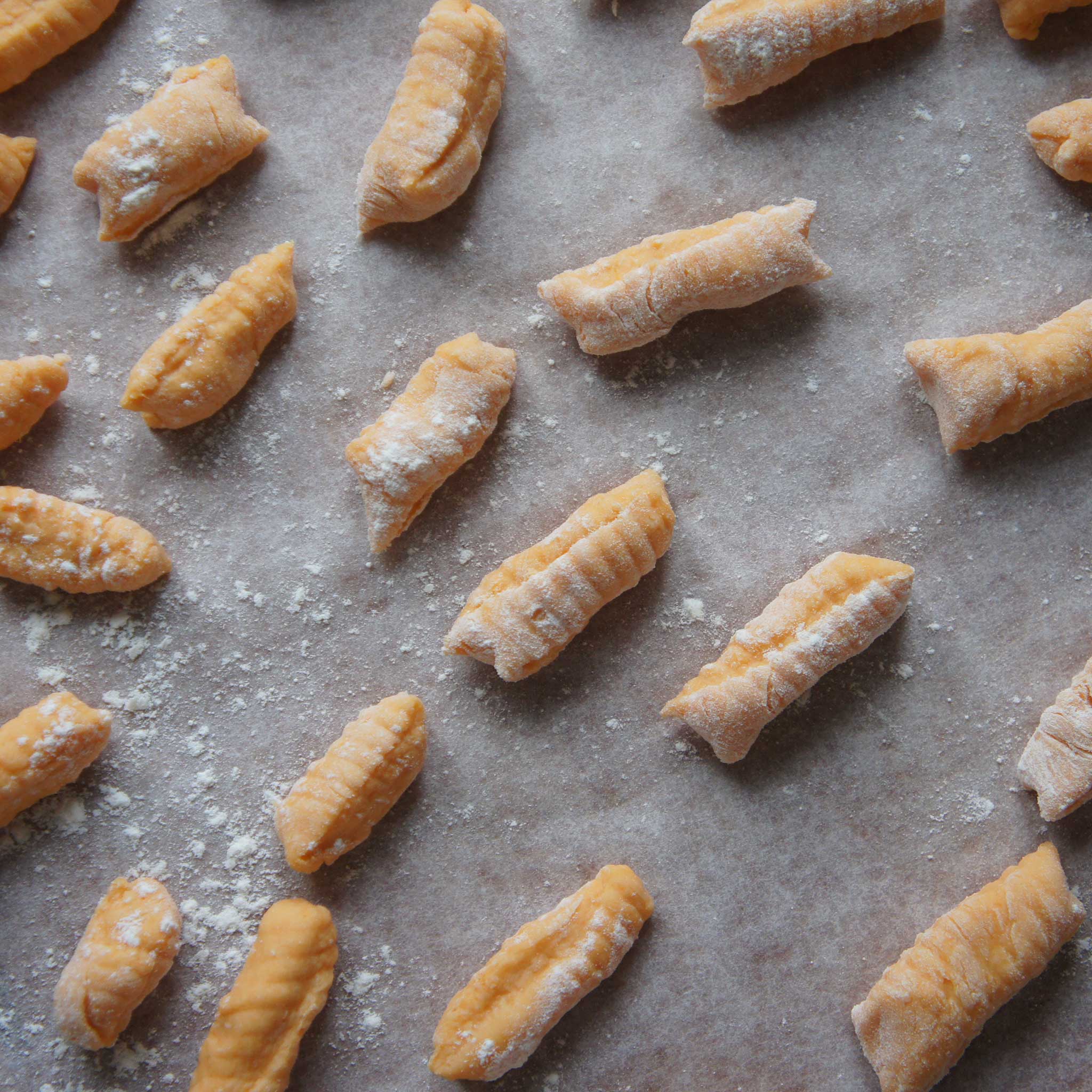 Sweet potato gnocchi on parchment paper