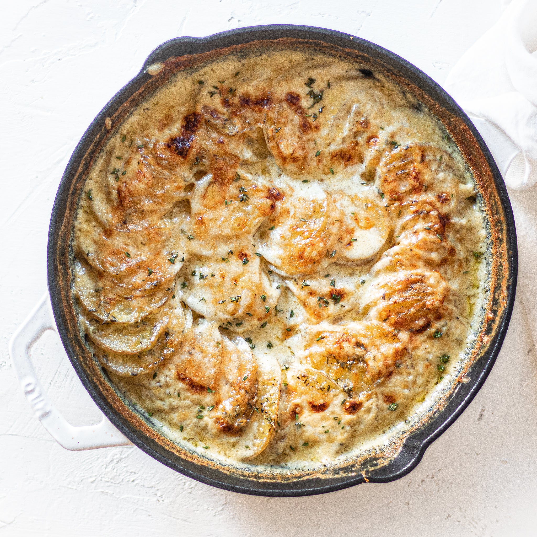 cheesy potato gratin in dutch oven