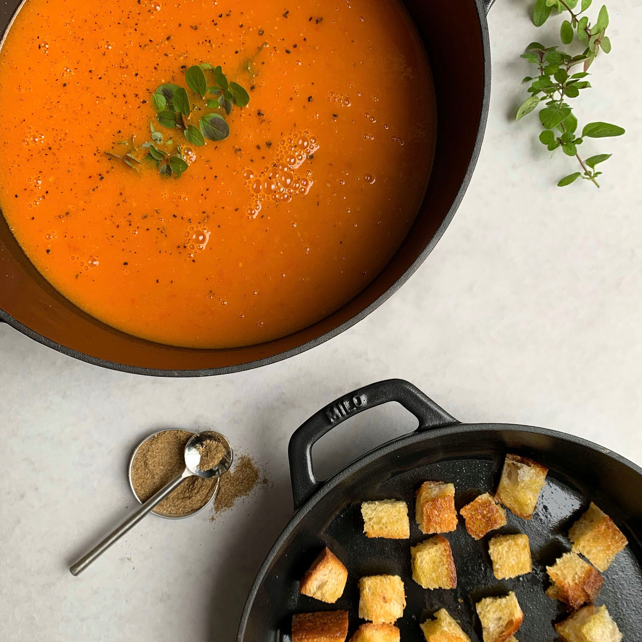 tomato soup in dutch oven with crispy croutons
