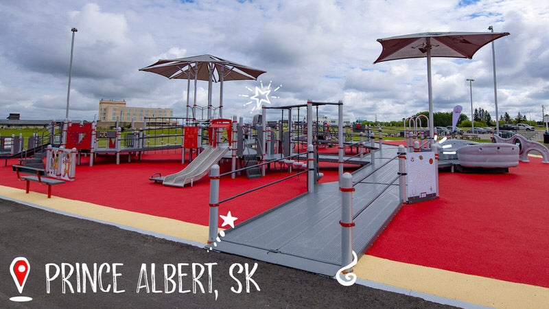 A photo of the Jumpstart Inclusive Playground in Prince Albert, Saskatchewan showing the seamless transition between the park pathway, playground surfacing, and double-wide ramps on the playground structure.