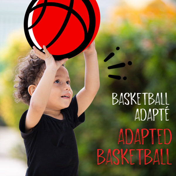Adapted Basketball. A young boy holds up a basketball.