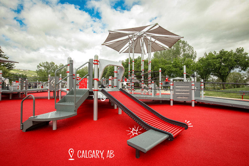 A photo of the Jumpstart Inclusive Playground in Calgary, Alberta showing a roller slide.