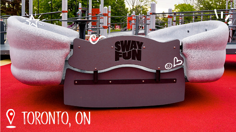 A photo of the Jumpstart Inclusive Playground in Toronto, Ontario showing the Sway Fun Glider.