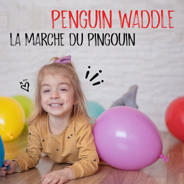 Penguin Waddle. A young girl, smiling, lays prone on the floor with a balloon in her hand and multiple balloons scattered around her.