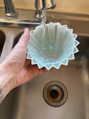 rinsing an Origami brand paper filter to remove woody flavors