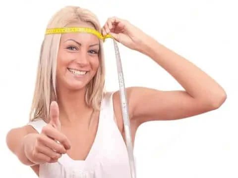 Women measuring her head for ski goggle