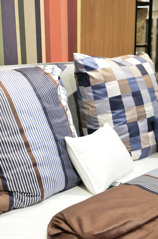Checked and striped cushion