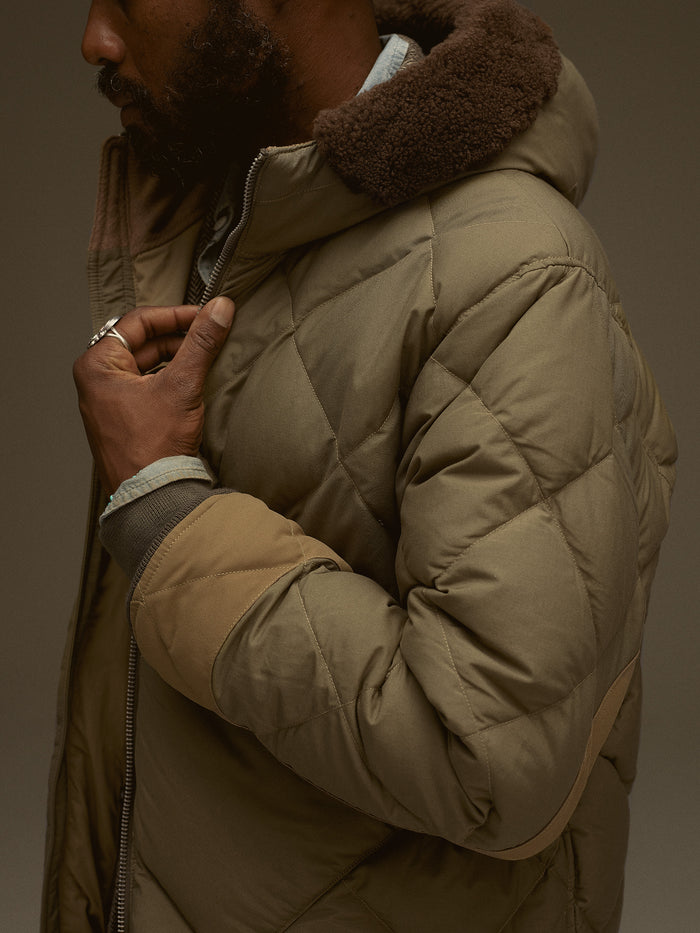 Model wearing Burnt Olive Cascade Down Eddie Bauer '42 Flight Parka - Side