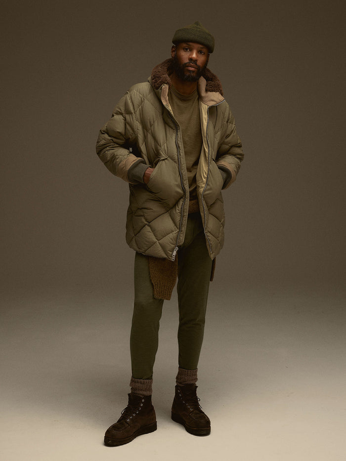 Model wearing Olive Heather Mountain-Spec Merino Eddie Bauer Base Layer Trouser 01