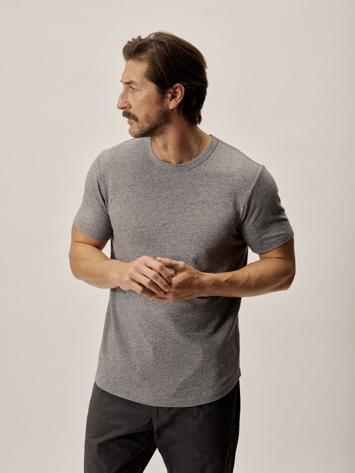 Model Wearing Heather Grey Trail Traverse Curved Hem Tee